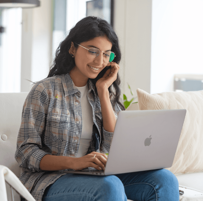 Indian Girl working with her refurbished MacBook 