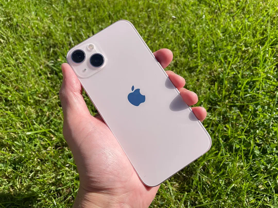 Person holding iPhone 13